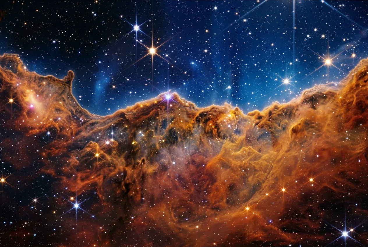 JWST infrared image of the Cosmic Cliffs in the Carina Nebula revealing hidden protostars
