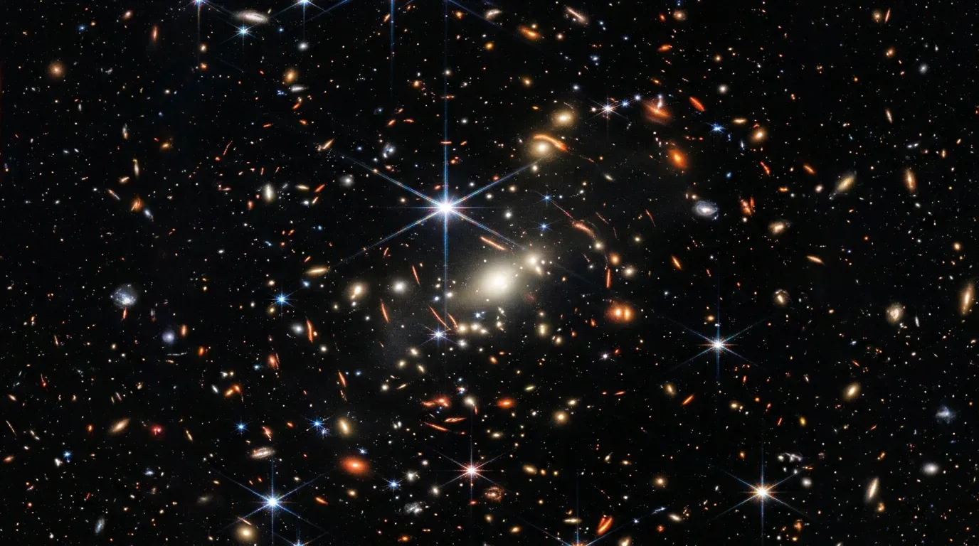 James Webb Space Telescope's first deep field image showing thousands of galaxies against the black backdrop of space
